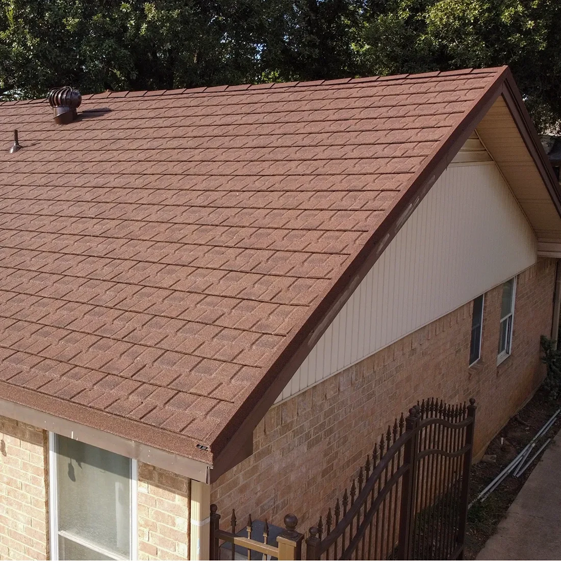 Completed residential roof with Timber Wood Stormetal shingles